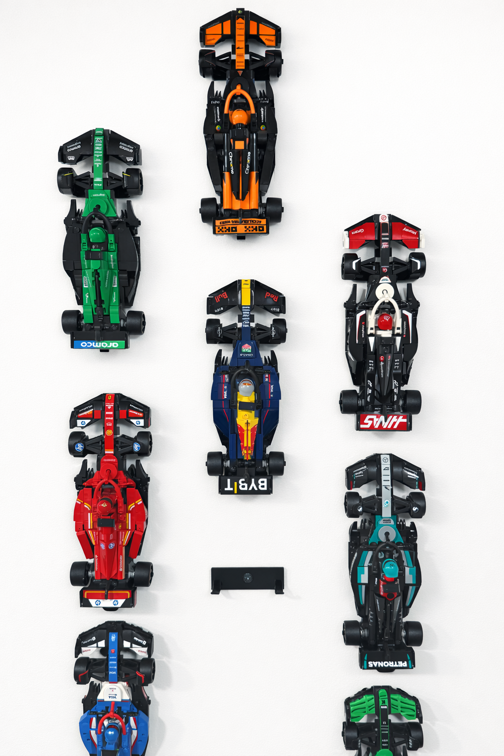 F1 LEGO Speed Champions wall mount holding red Ferrari on white wall