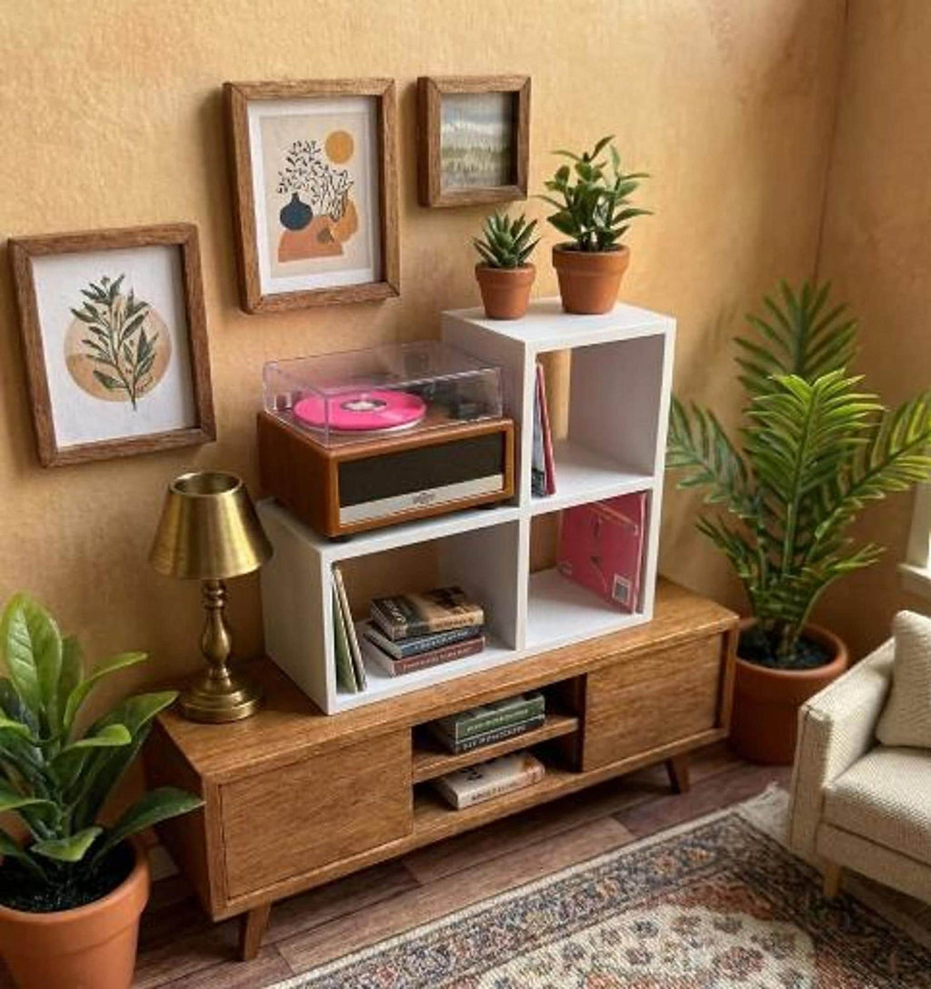 White mini vinyl display stand holding a mini record player and mini records in a styled miniature living room